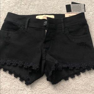 Hollister black denim shorts with floral trim